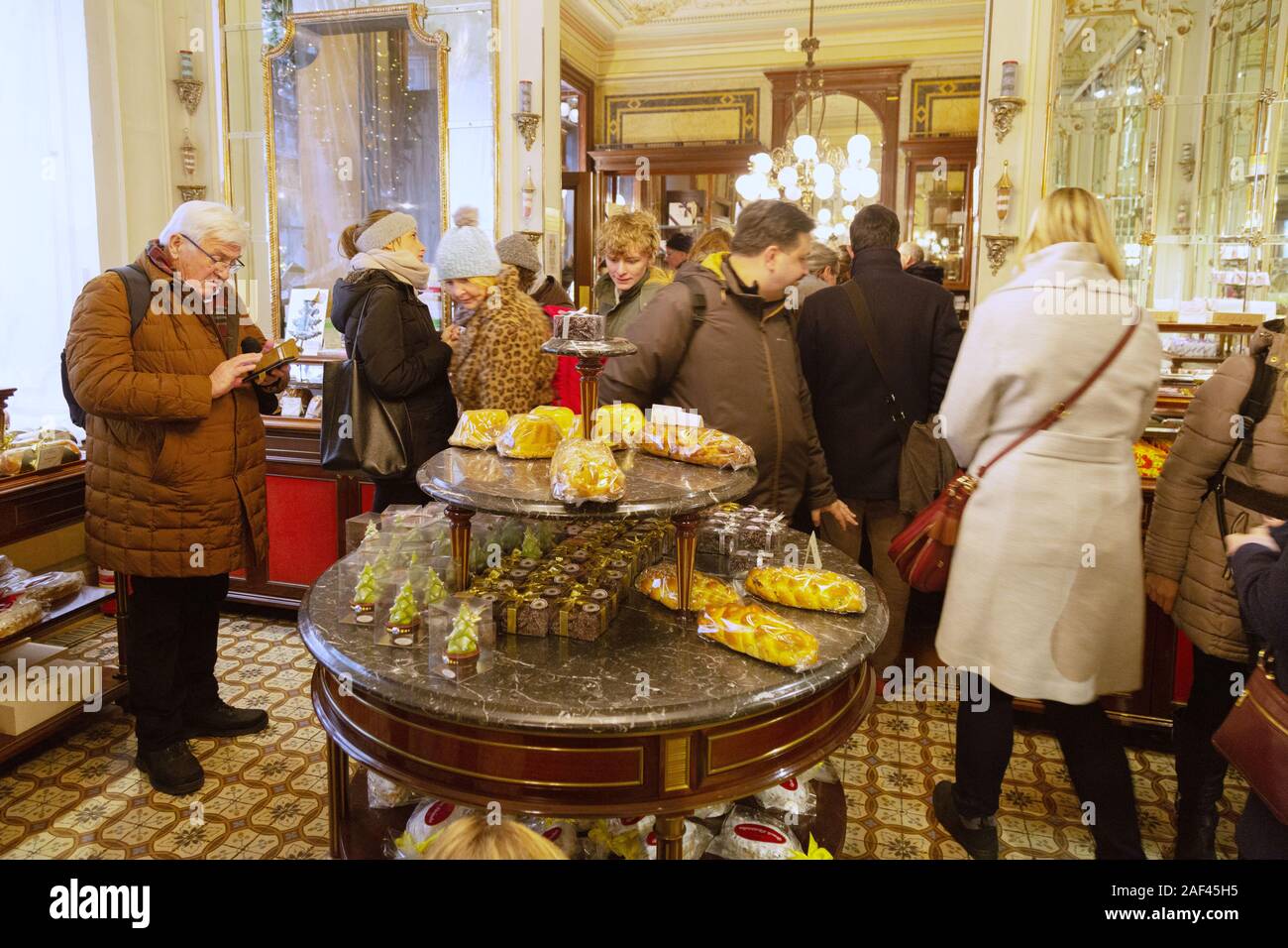 Vienna cafe Demel interior; Customers looking at cakes, the Demel coffee house and salon, Demel Vienna Austria Europe Stock Photo