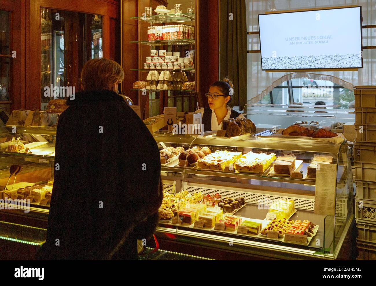 Vienna Cafe; a customer buying cakes at the Cafe Landtmann coffee house and Chocolaterie, Vienna Austria Europe Stock Photo