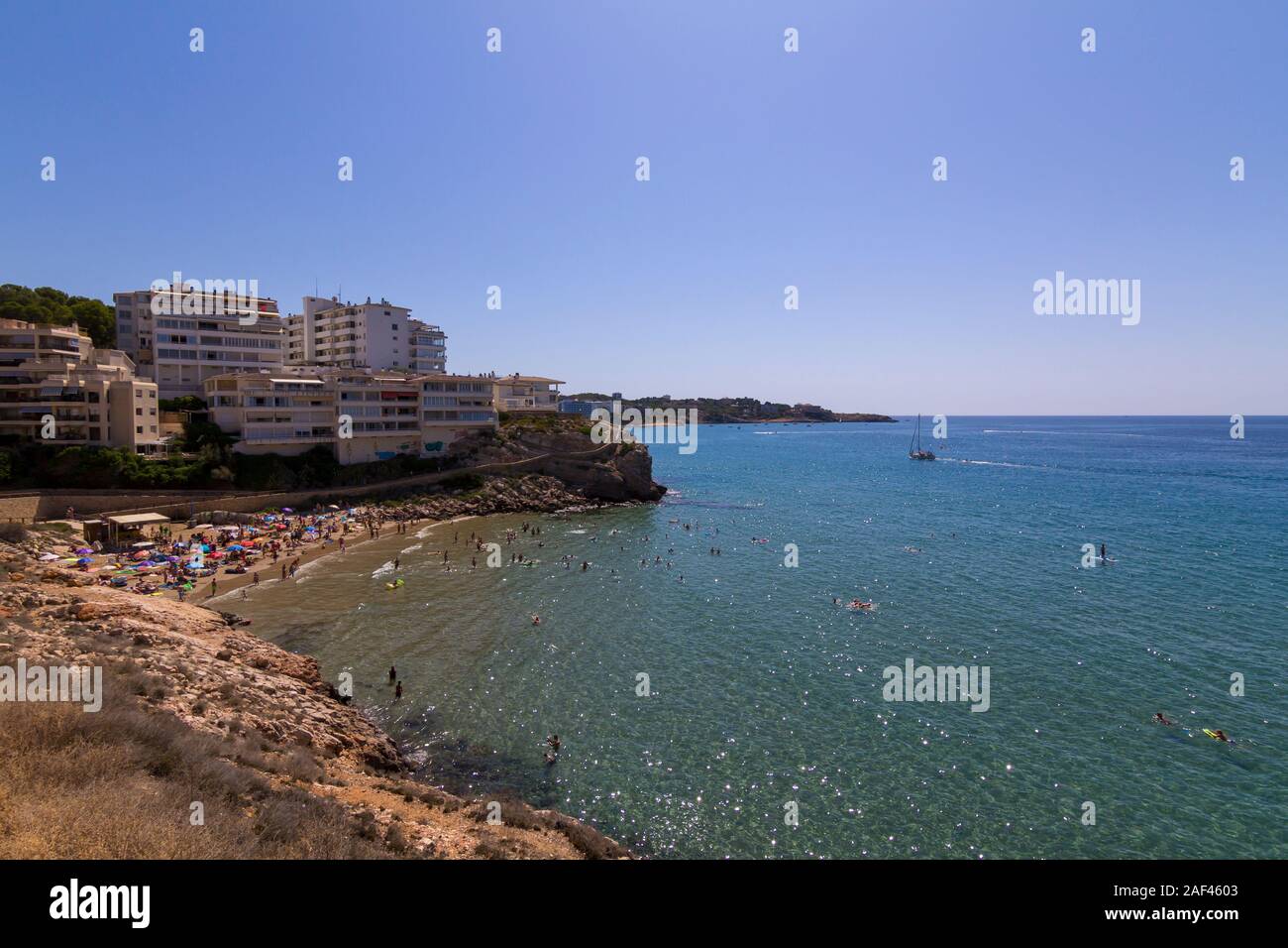 People having fun at Cala Llenguadets beach in Salou, a famous tourist destination at summer in Spain Stock Photo