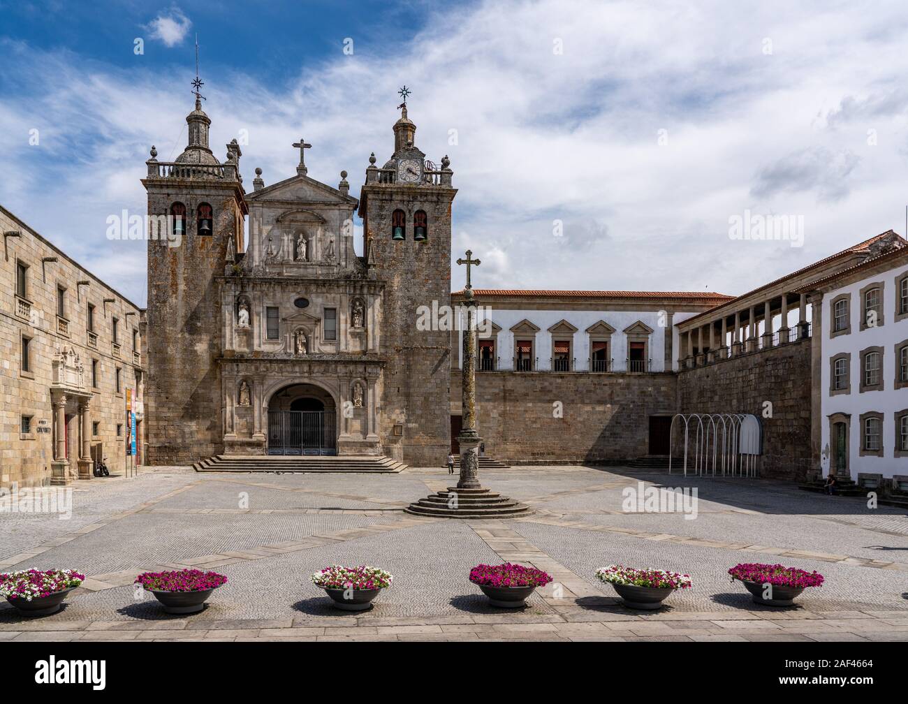 Main cathedral or Se in Viseu with stone cross and large empty square Stock Photo