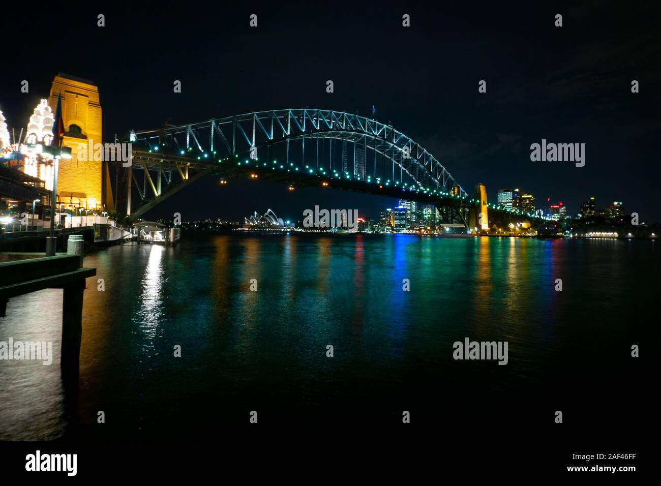 Sydney Harbour Bridge and the Opera House at night, from North Shore, Sydney, Australia Stock
