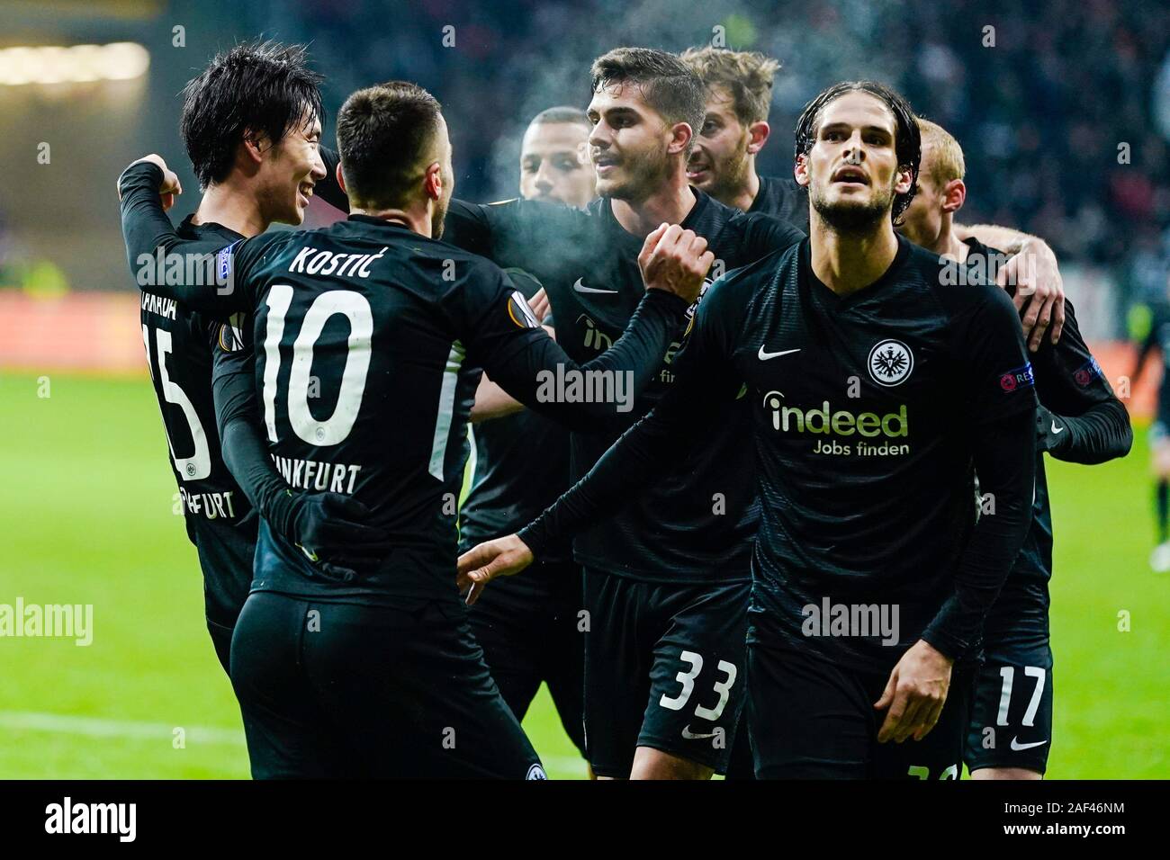 12 December 2019, Hessen, Frankfurt/Main: Soccer: Europa League, Eintracht Frankfurt - Vitoria Guimaraes, Group stage, Group F, 6th matchday, in the Commerzbank Arena. Frankfurt's Daichi Kamada (l-r) cheers with team-mates Philip Kostic, Andre Silva and Goncalo Pacuiencia over the goal to 2:1. Photo: Uwe Anspach/dpa Stock Photo
