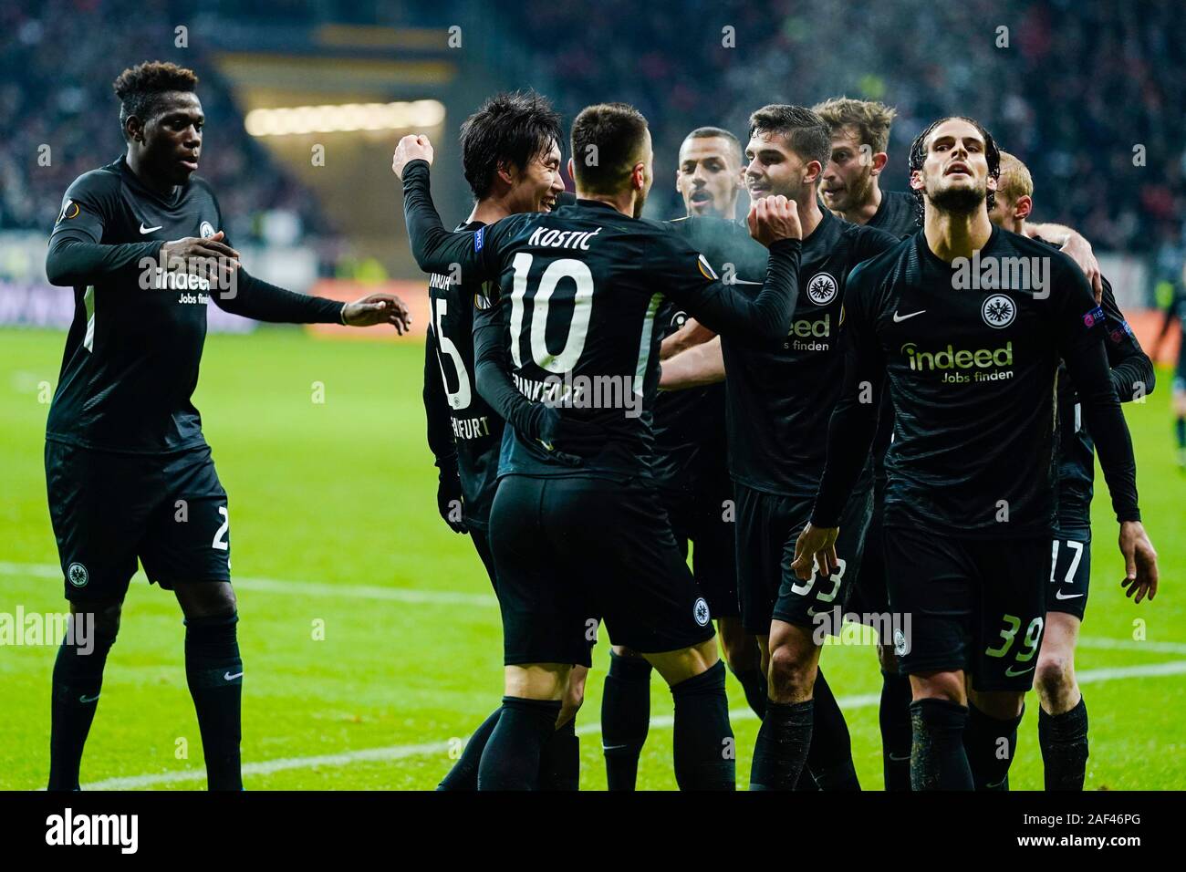 12 December 2019, Hessen, Frankfurt/Main: Soccer: Europa League, Eintracht Frankfurt - Vitoria Guimaraes, Group stage, Group F, 6th matchday, in the Commerzbank Arena. Frankfurt's shooter to 1:1, Danny da Costa (l-r) cheers with the shooter to 2:1, Daichi Kamada and teammates Philip Kostic, Andre Silva and Goncalo Paciencia over the goal to 2:1. Photo: Uwe Anspach/dpa Stock Photo