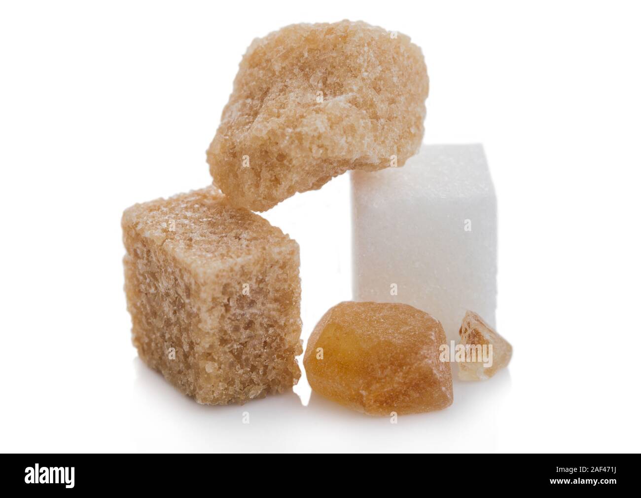Cubes of natural brown and white and caramelized unrefined sugar cubes