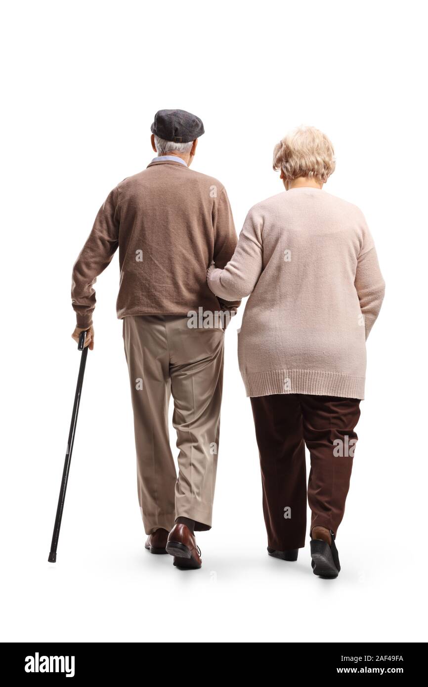 Full length rear view shot of a senior man and woman walking isolated on white background Stock Photo