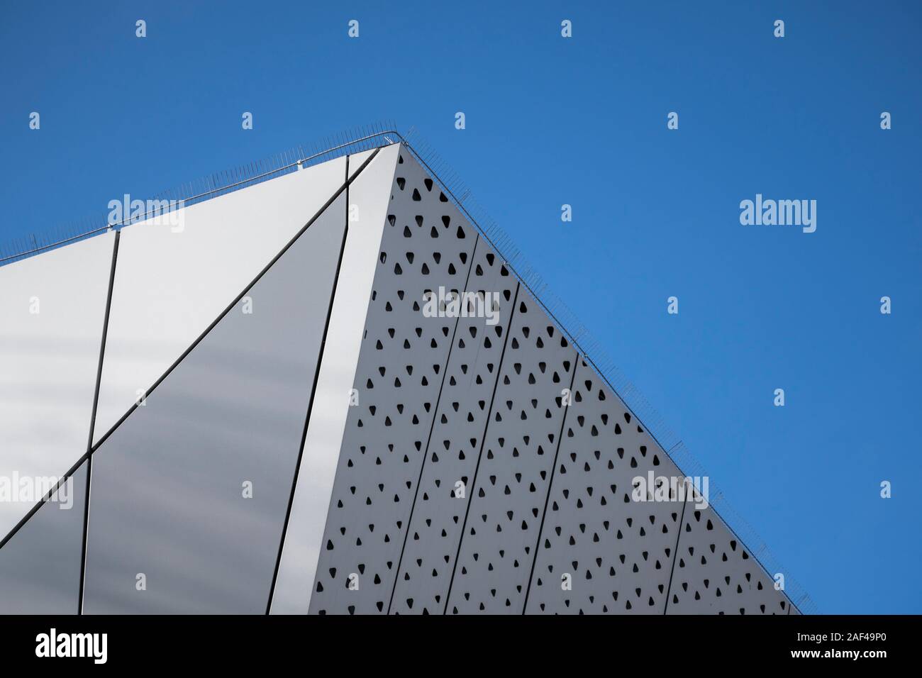 Architecture detail of a modern building with a blue sky on background ...