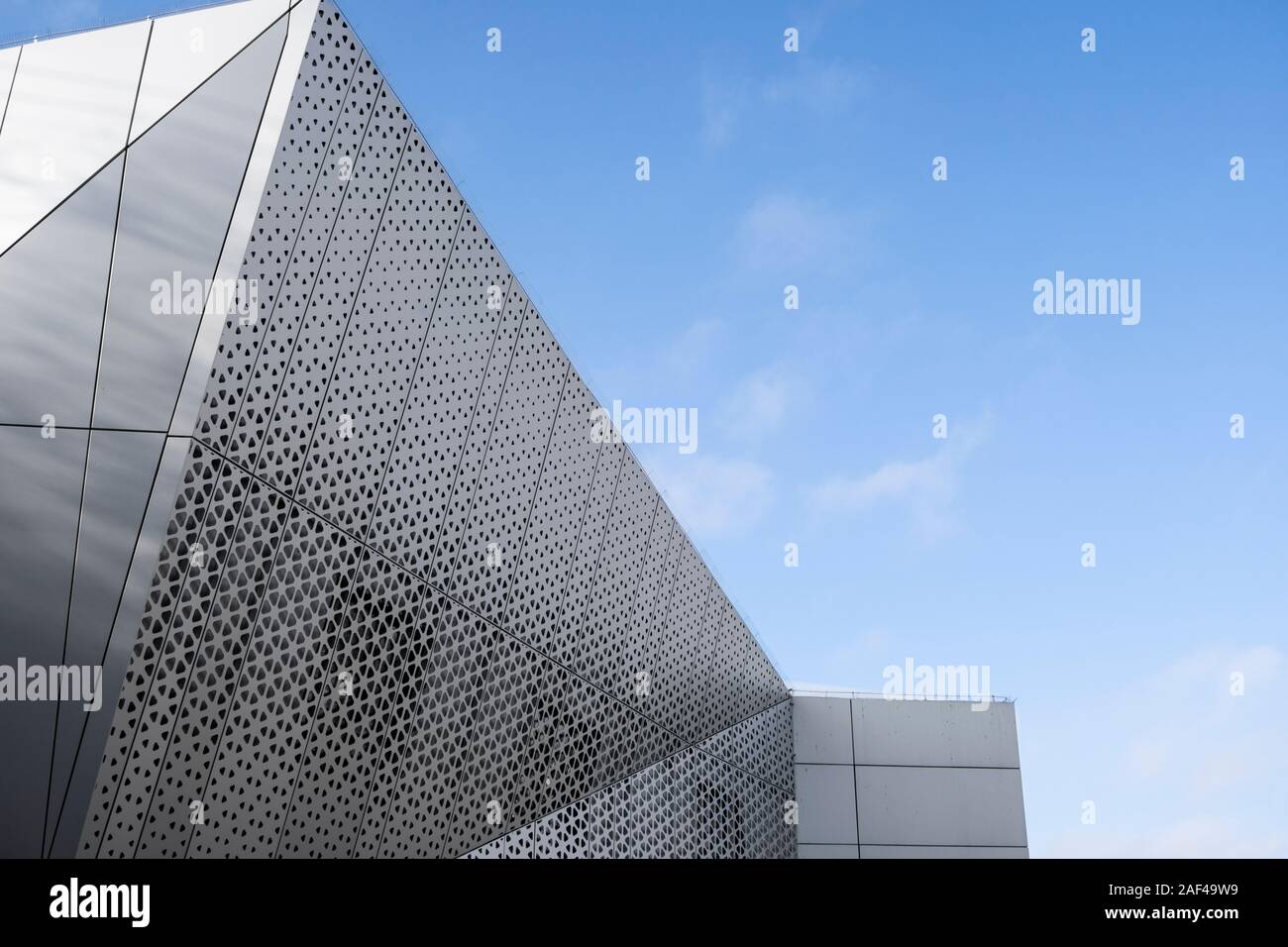 Architecture detail of a modern building with a blue sky on background ...