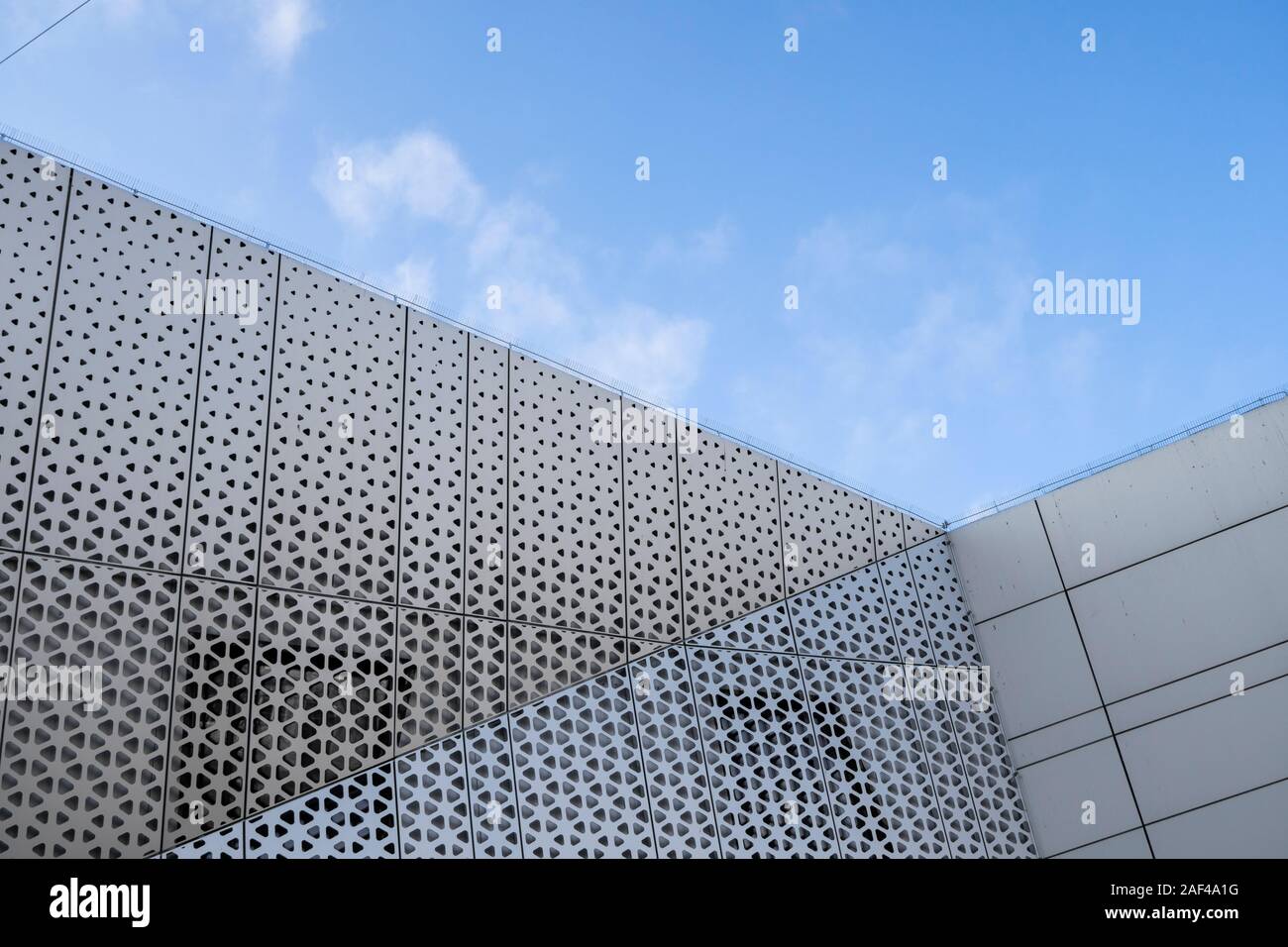 Architecture detail of a modern building with a blue sky on background ...