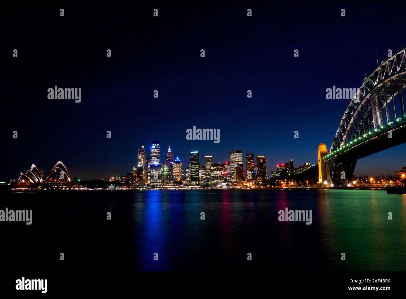 Sydney Harbour Bridge and the Opera House at night, from Jeffrey Street ferry stop at Milsons