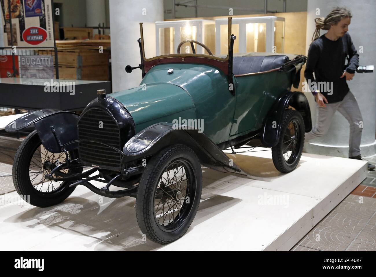 Moscow Russia December 12 19 A Visitor By A Peugeot Bebe Bp1 1913 Car On Display At An Exhibition Titled Russo Balt The First Legendary At Moscow S Vdnkh Exhibition Center The Exhibition