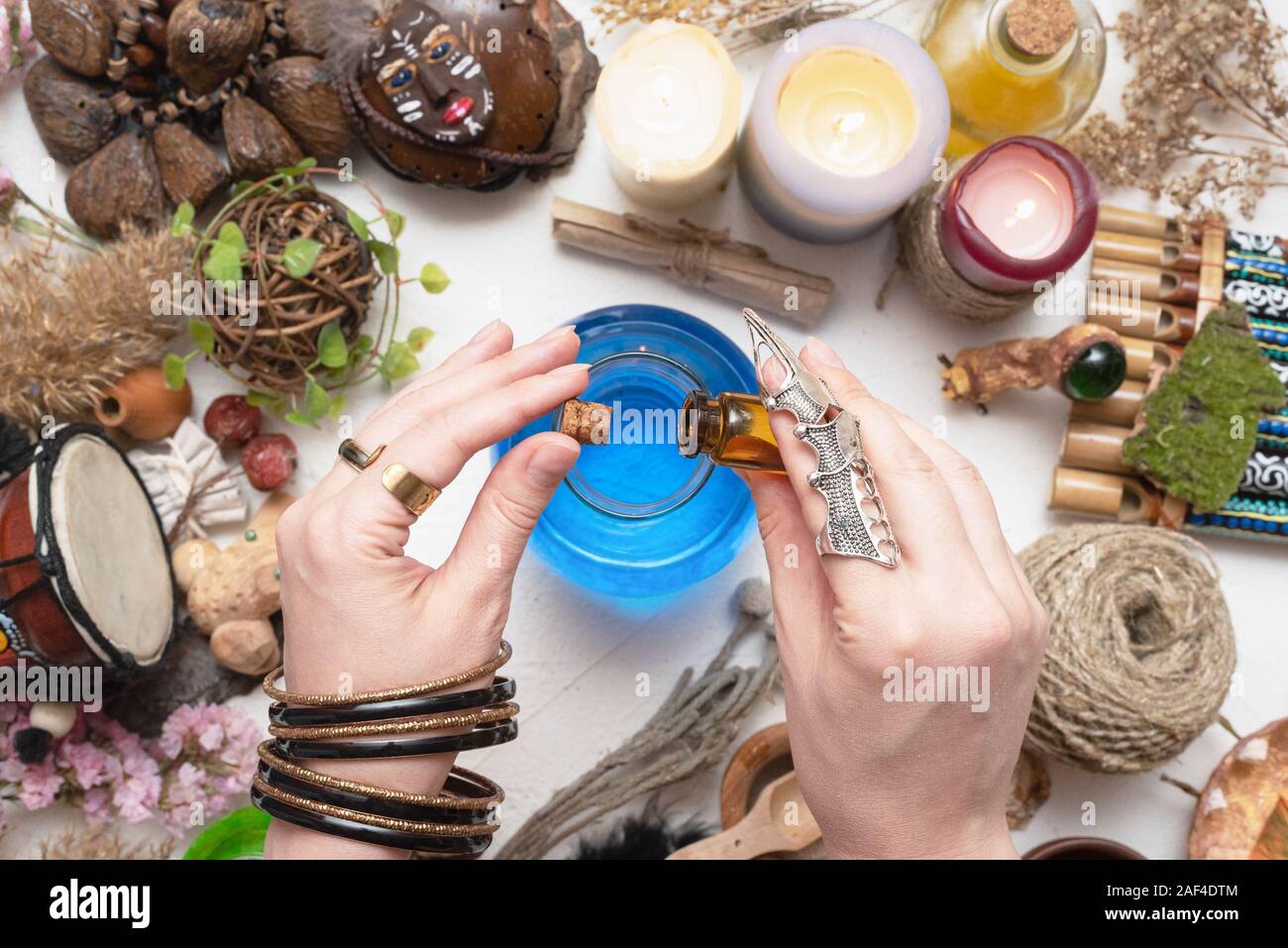 Witch doctor is preparing a magic potion close up. Stock Photo