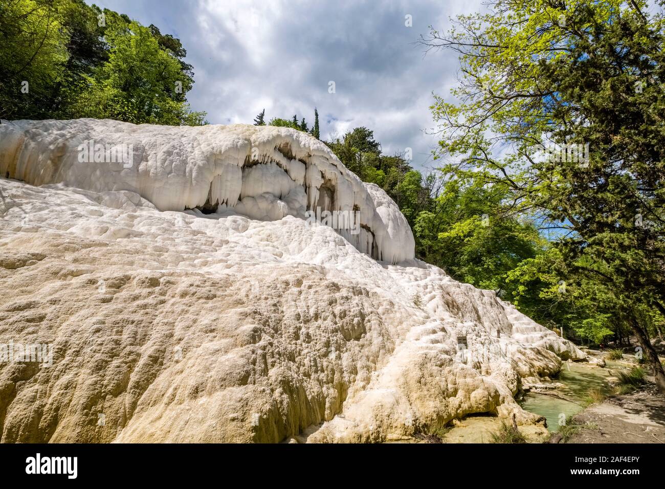 The Balena, a white travertine stone in the Fosso Bianco valley, the thermal springs of Bagni San Filippo Stock Photo