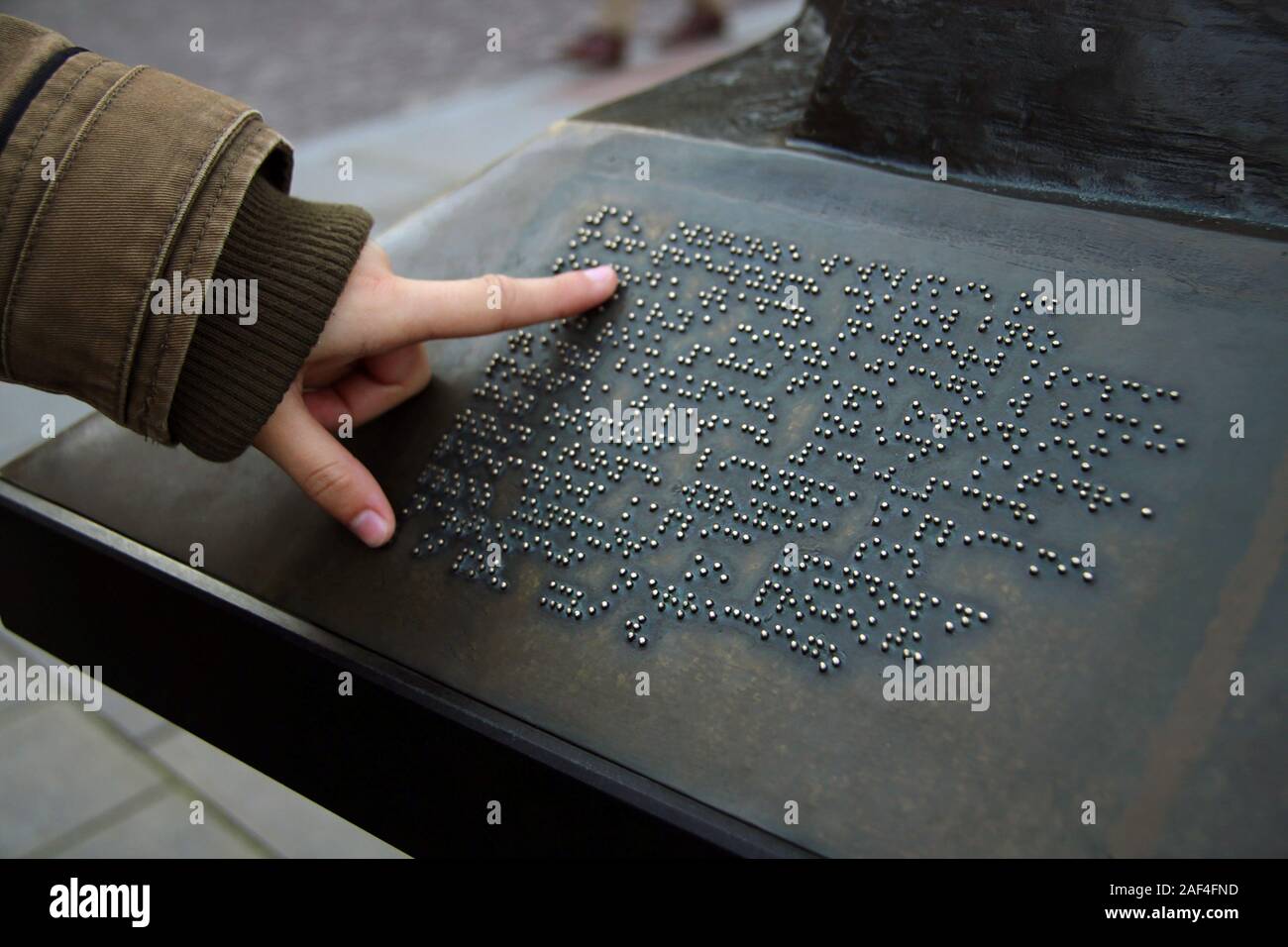 Blind person reading a Braille text. Braille language concept Stock