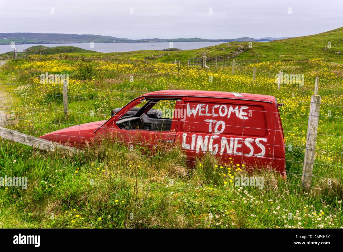 Welcome to Lingness written on the side of an old abandoned car at Lingness, Mainland Shetland. Stock Photo