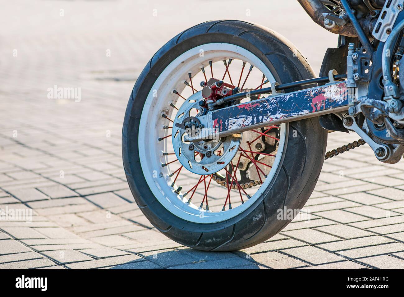 Closeup rear motorcycle wheel and exhaust pipe. Rear wheel motorcycle ...