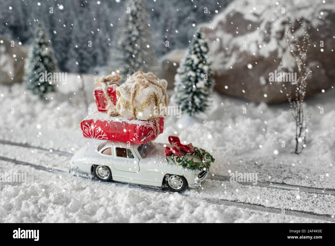 Miniature Classic Car Carrying A Christmas Gifts On Snowy Road On Magic Winter Landscape Stock Photo Alamy