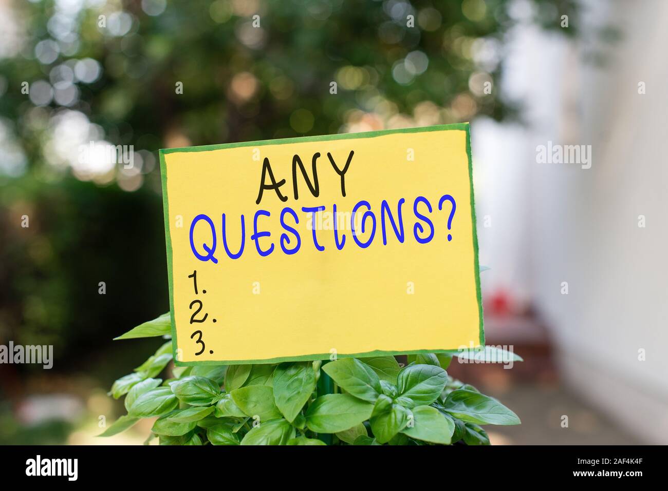 Writing note showing Any Questions Question. Business concept for