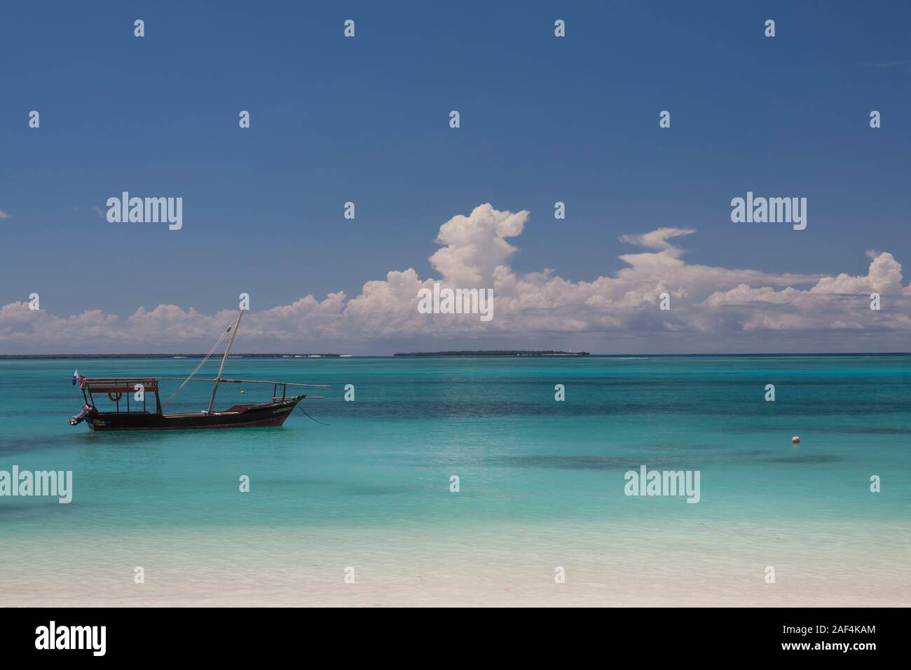small boat floating at Kendwa beach Zanzibar Stock Photo Alamy