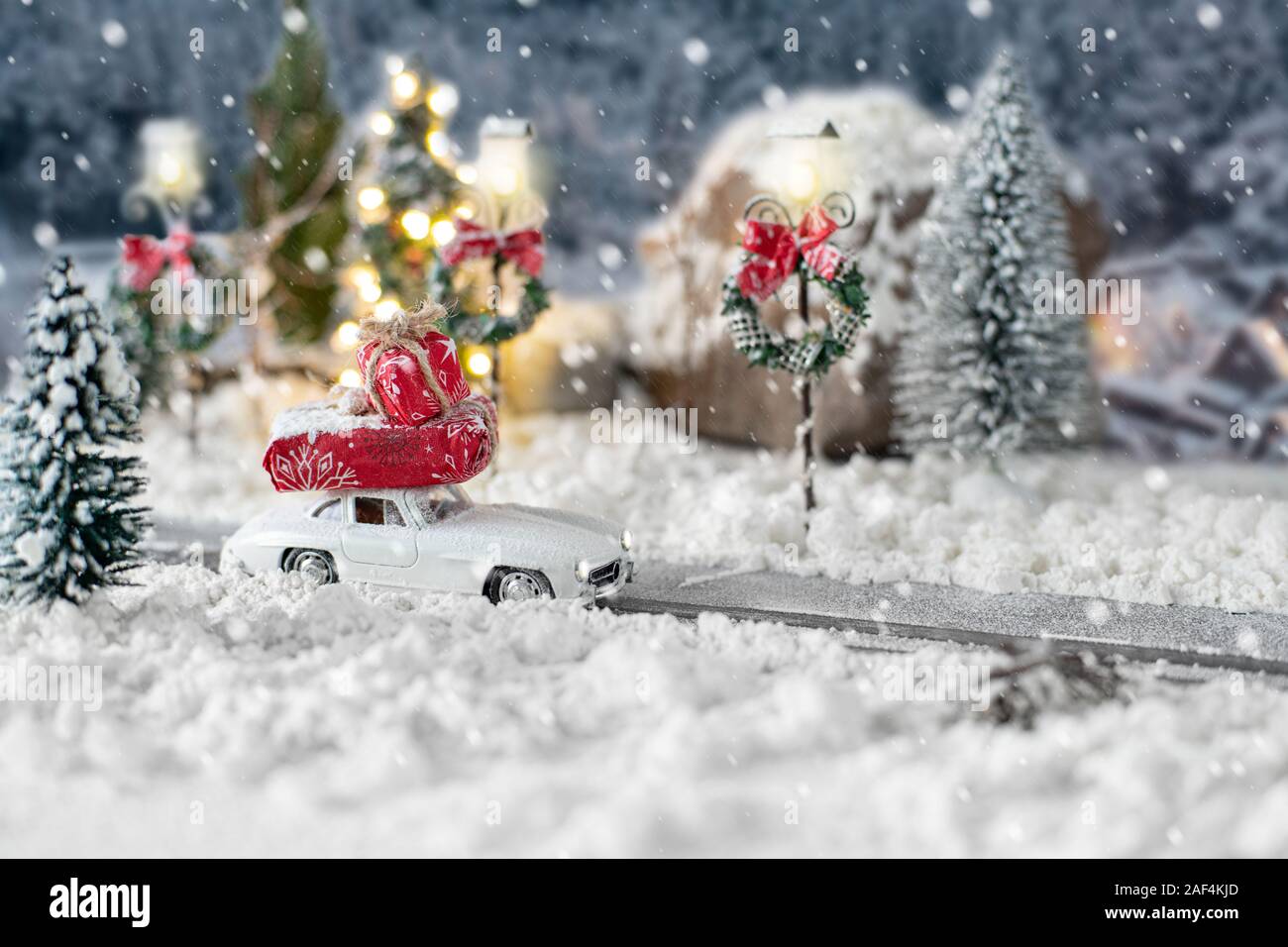 Miniature Classic Car Carrying A Christmas Gifts On Snowy Road On Magic Winter Landscape Stock Photo Alamy