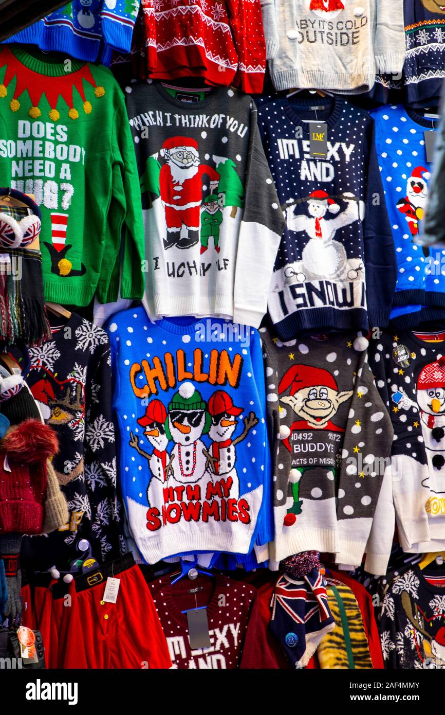 Souvenir shop in London, Great Britain, sweaters and T-shirts with winter and Christmas motifs, Stock Photo