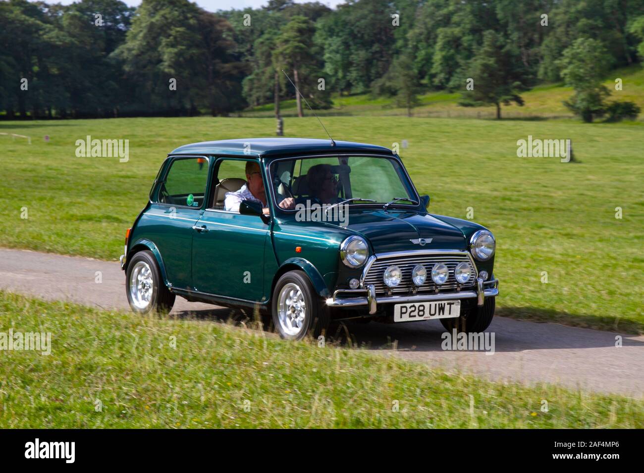 1997 90s green Rover Mini 1.3 MPI ; Classic cars, historics, cherished, old timers, collectable restored vintage veteran, vehicles of yesteryear arriving for the Mark Woodward historical motoring event at Leighton Hall, Carnforth, UK Stock Photo