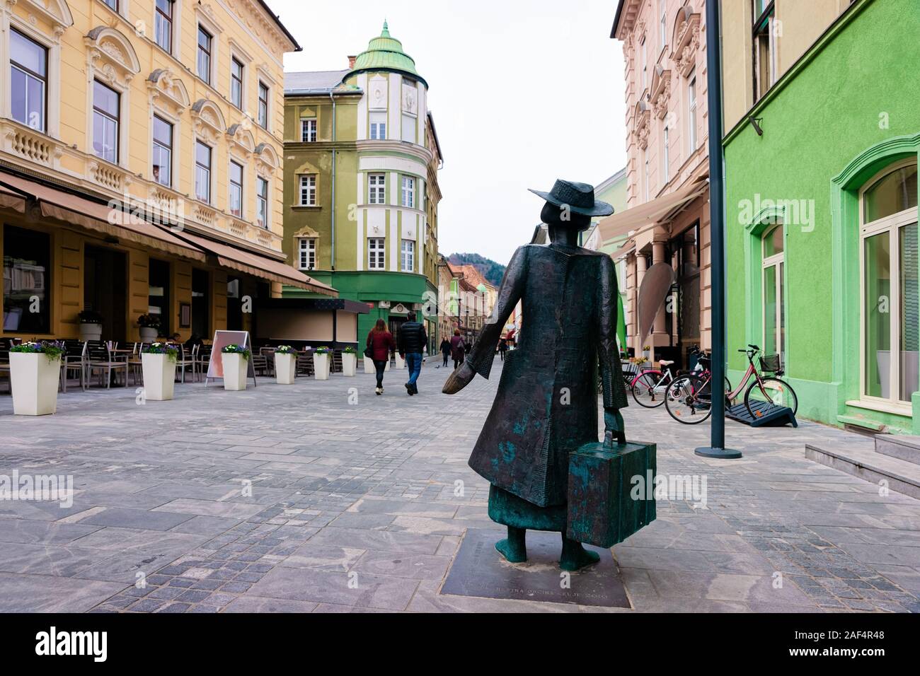 Cityscape with Woman statue in street of Celje town Slovenia Stock Photo