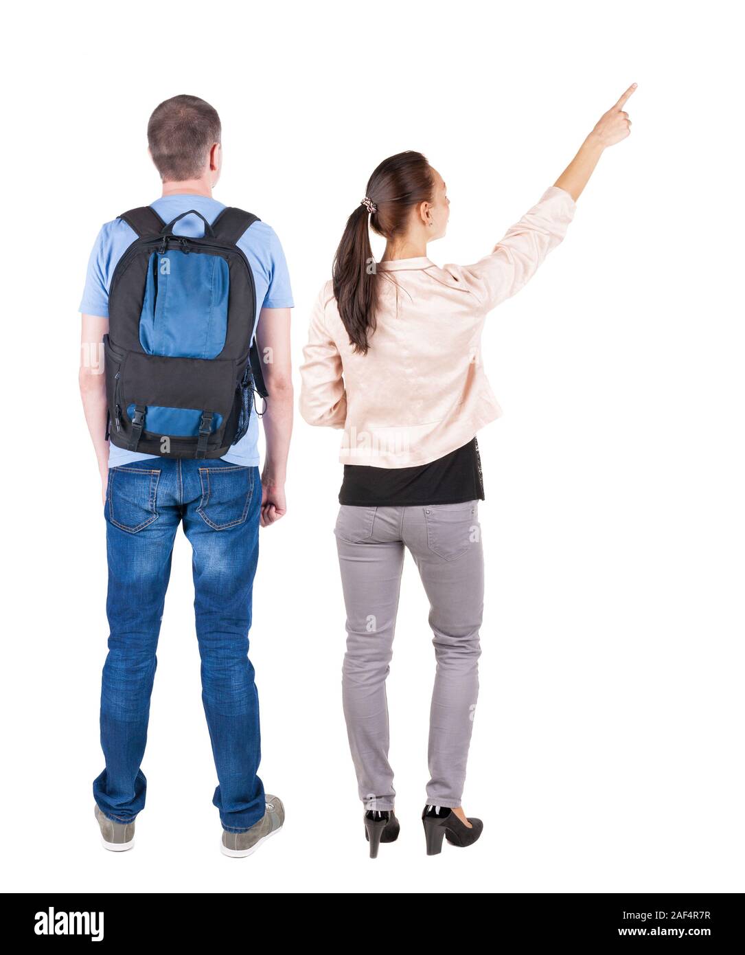 Back view of a stylish couple pointing. beautiful friendly girl and guy ...