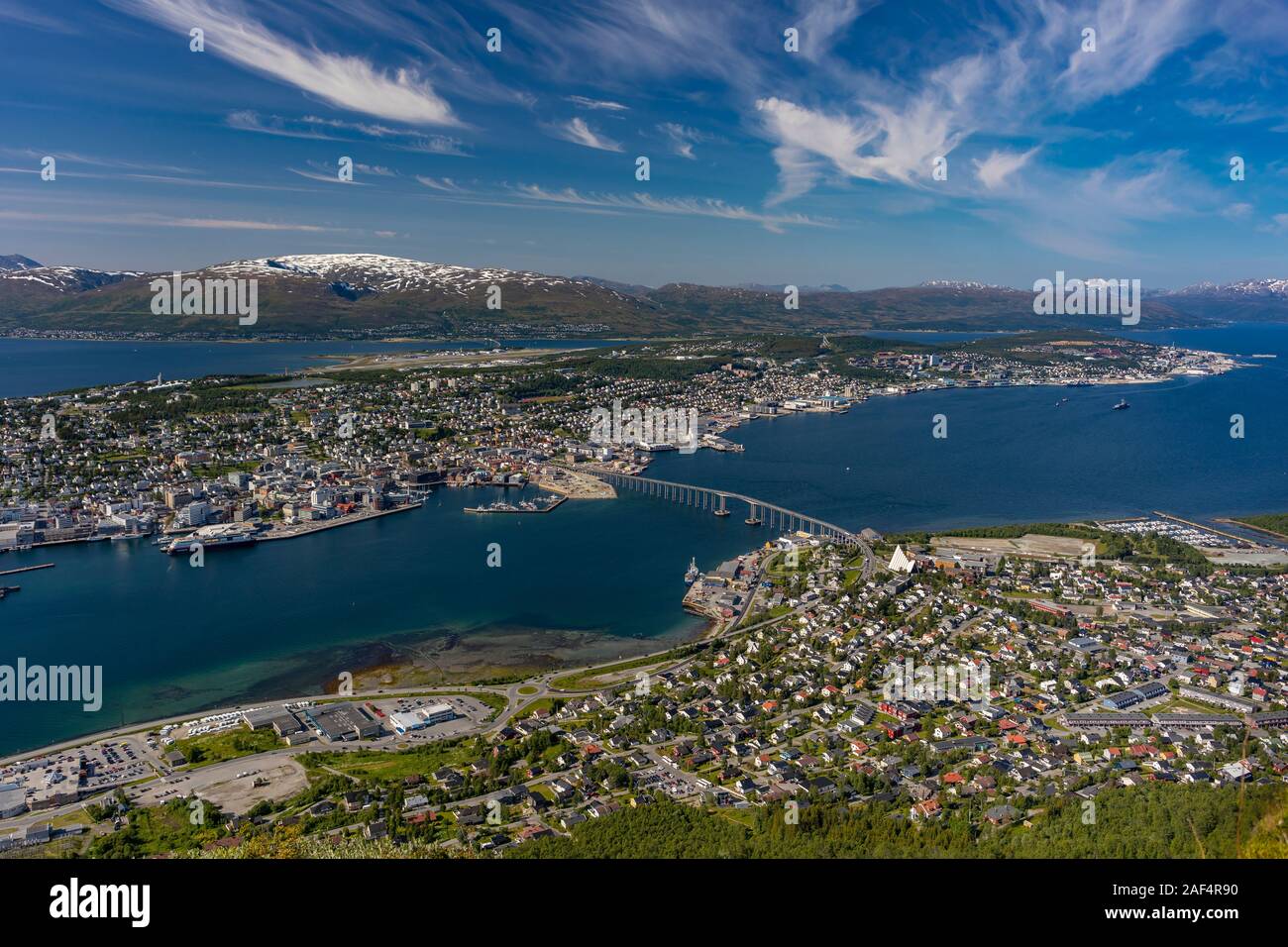 TROMSØ, NORWAY - Aerial view Tromsø Bridge, crossing Tromsøysundet strait from Tromsøya island, left, to Tramsdale. Stock Photo