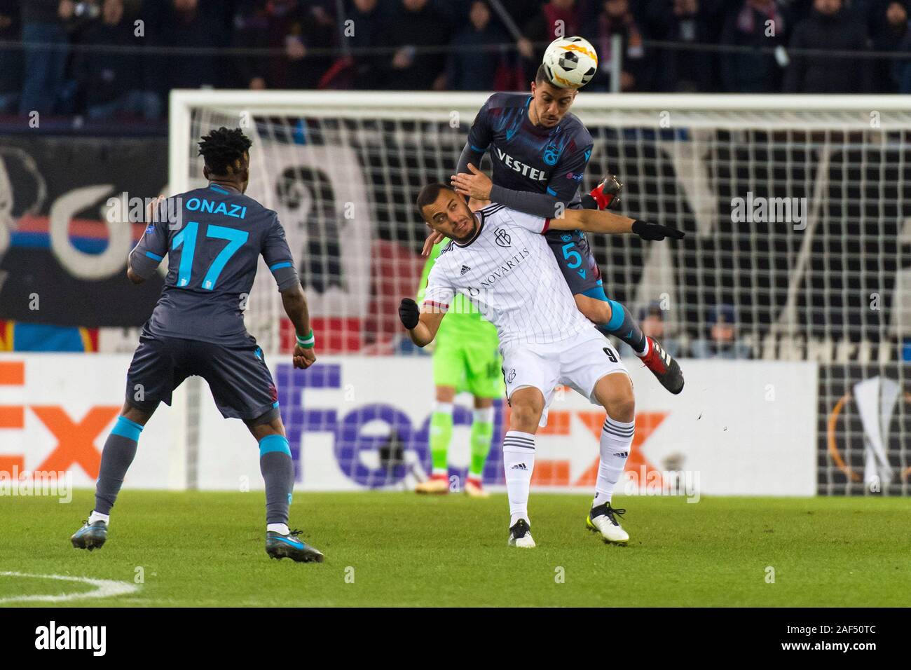 St Jakob Park, Basel, Switzerland. 12th Dec, 2019. UEFA Europa League Football, FC Basel versus Trabzonspor; Majid Hosseini of Trabzonspor heads the ball away under pressure from Arthur Cabral of FC Basel - Editorial Use Credit: Action Plus Sports/Alamy Live News Stock Photo