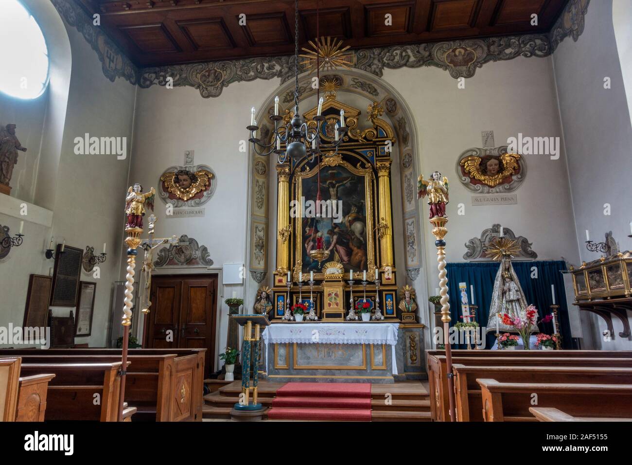 Inside the chapel inside the Fuggerei, a walled enclave within the city of Augsburg, Bavaria, Germany. Stock Photo