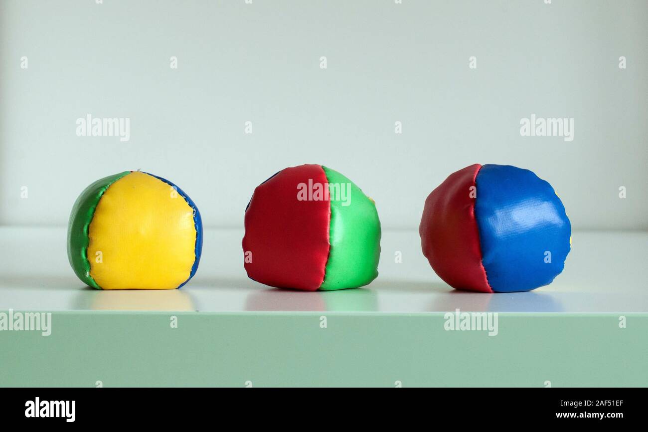 Three colourful juggling balls, isolated on a white background Stock Photo