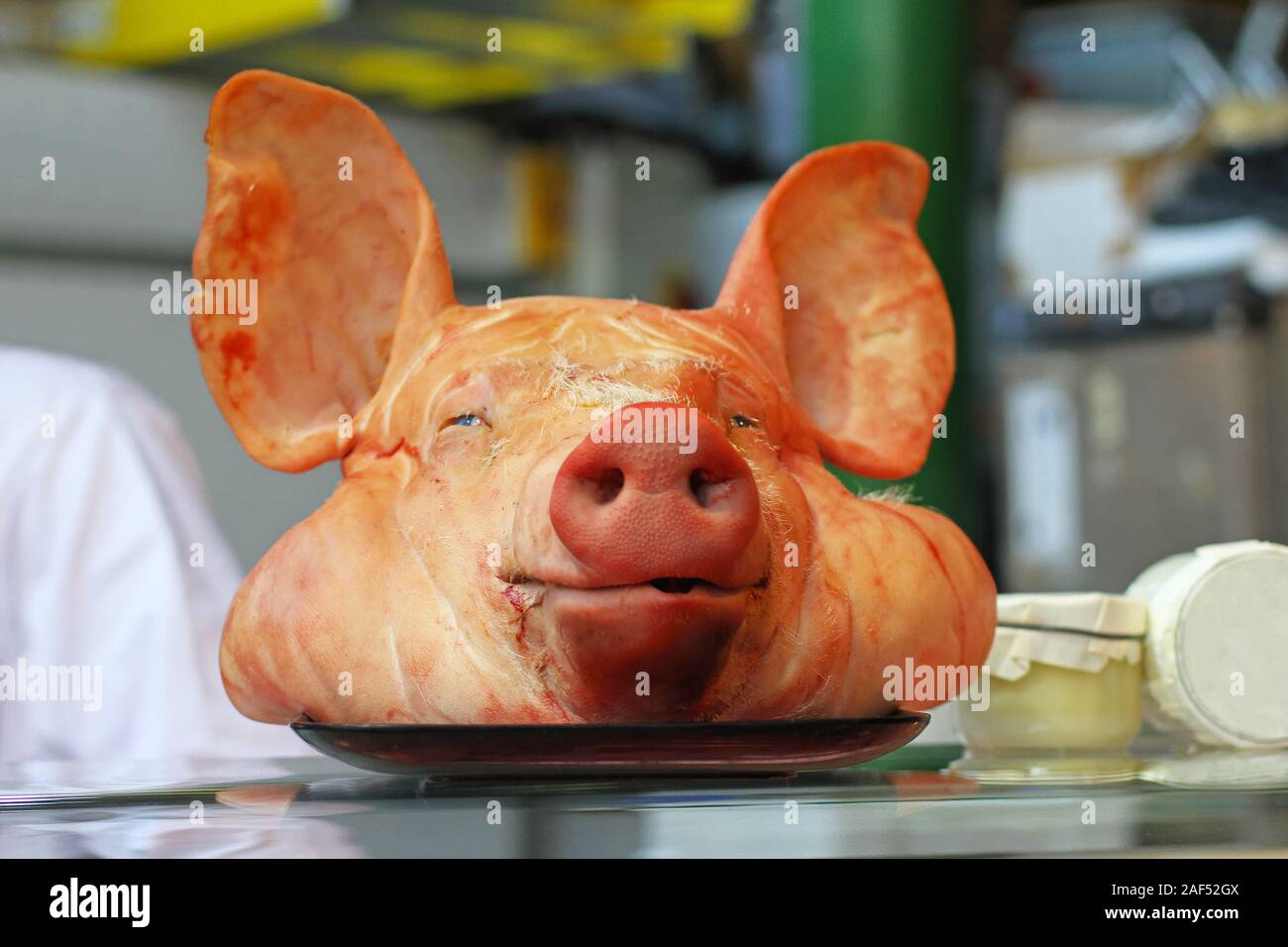 Decapitated pig head with big ears in butcher shop Stock Photo Alamy