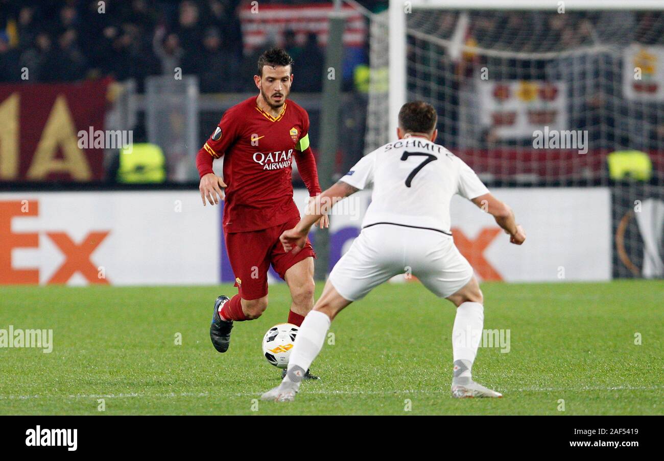 Rome, Italy, 12th December, 2019. RomaÕs Alessandro Florenzi, left, is challenged by Wolfsberg's Lukas Schmitz during the Europa League group J soccer match between Wolfsberg AC and Roma at the Olympic Stadium. Roma drawed 2-2 against Wolfsberg to join the round of 32. Credit Riccardo De Luca - UPDATE IMAGES / Alamy Live News Stock Photo