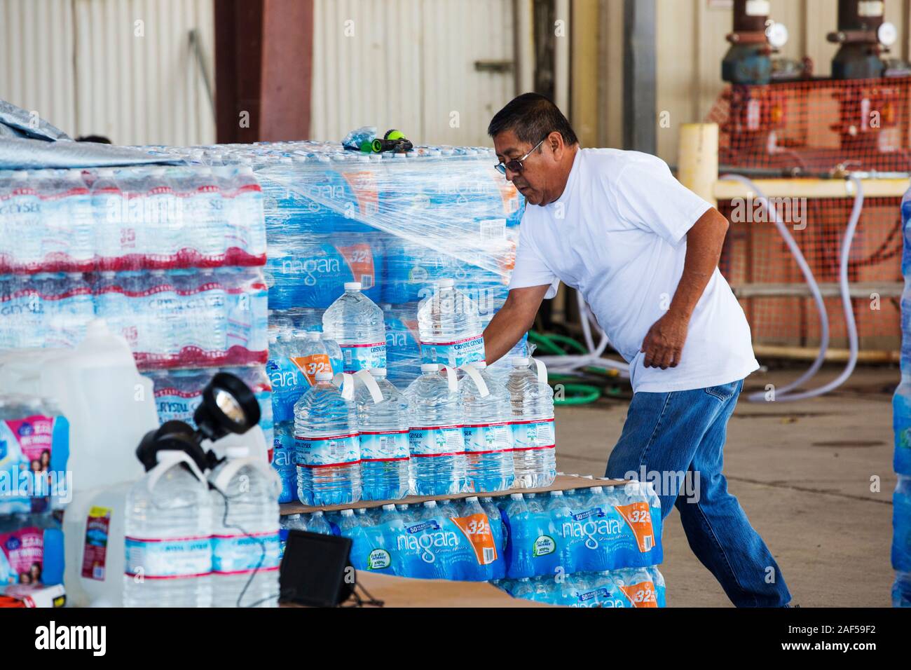 A water charity in Porterville supplying bottled water to houses who