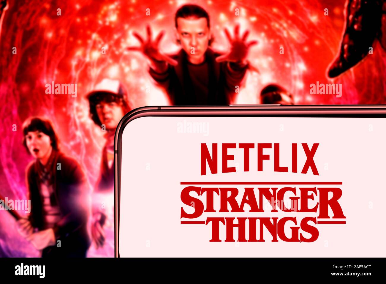 United States, New York. Sunday, September 29, 2019.Computer keyboard with the Iphone 11 pro with the Stranger Things logo. Stranger Things is an Amer Stock Photo