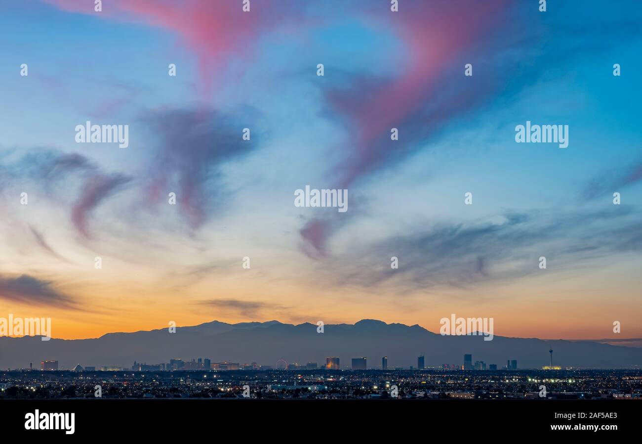 Sunset aerial view of the strip with mountain behind at Las Vegas, Nevada Stock Photo