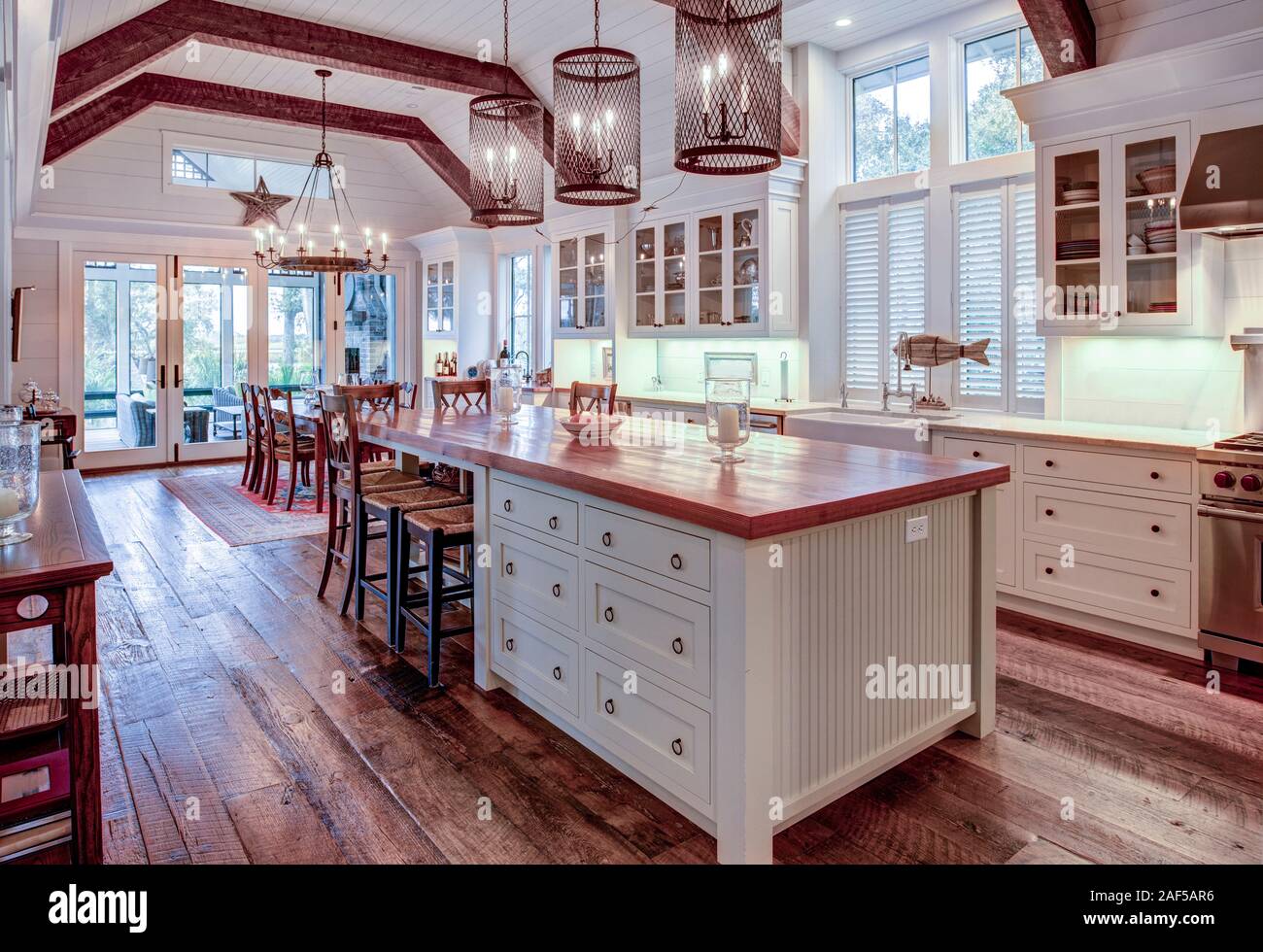 Beautiful luxury kitchen and dining room with view windows Stock Photo