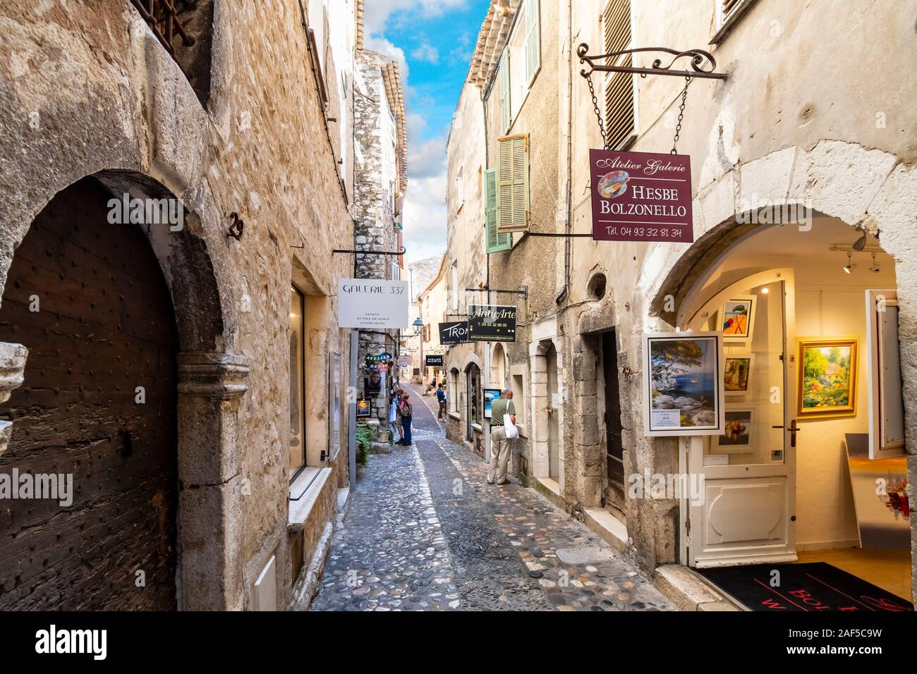 Shops and art galleries line the narrow cobblestone roads in the