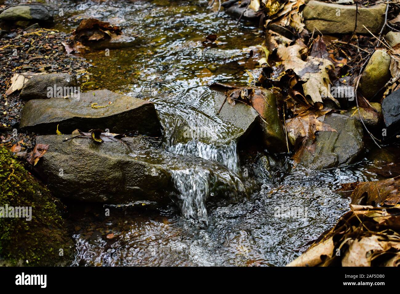 Peaceful stream flowing through rocks hi-res stock photography and ...