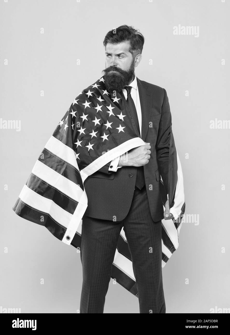 Independence means decide according to law and facts. Businessman bearded man in formal suit hold flag USA. Businessman concept. Successful businessman lawyer or politician. Business people. Stock Photo