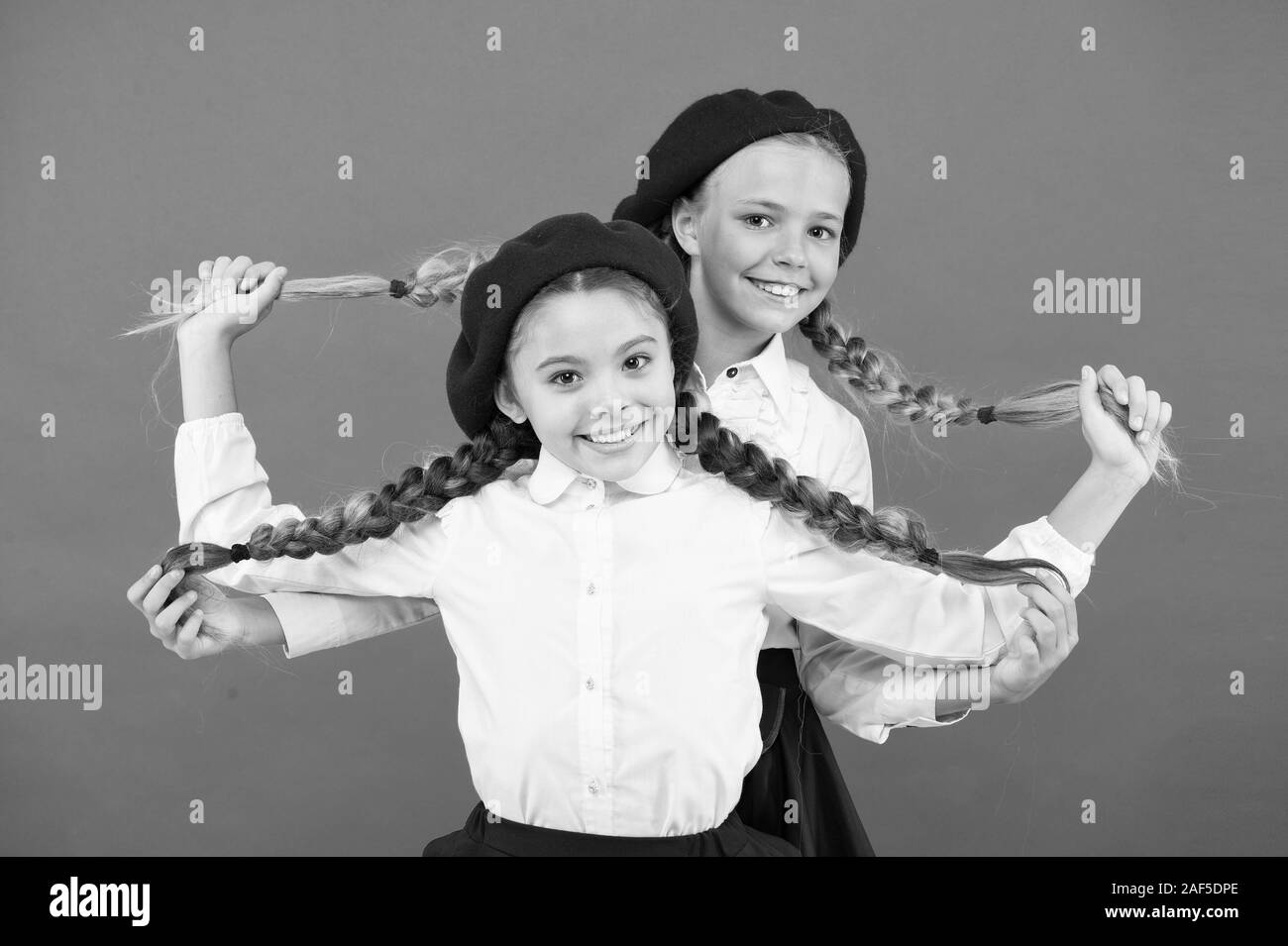 Friendship means support. Girls best friends on red background. True friends always stand beside