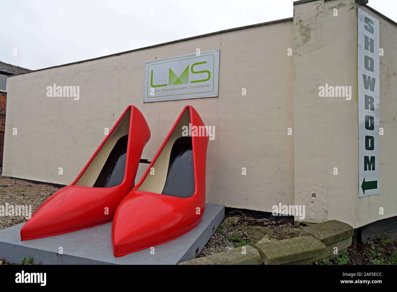 Giant Red Shoes, town centre, 20-24 Crossley St, Warrington, Cheshire, England, UK, WA1 2PF Stock Photo