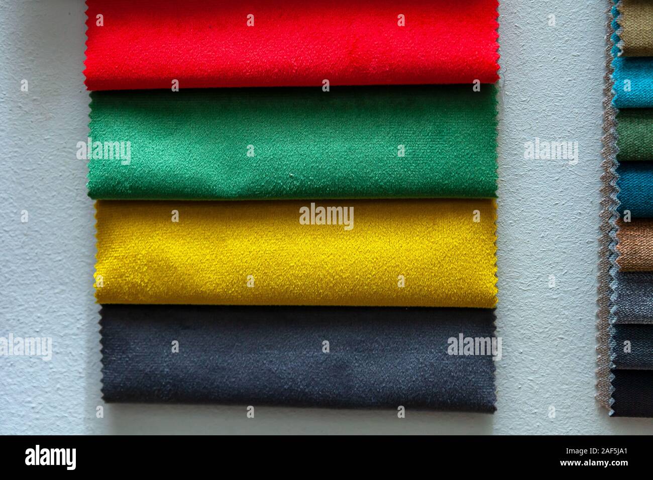 Pieces of textile material for interior trim and furniture making for