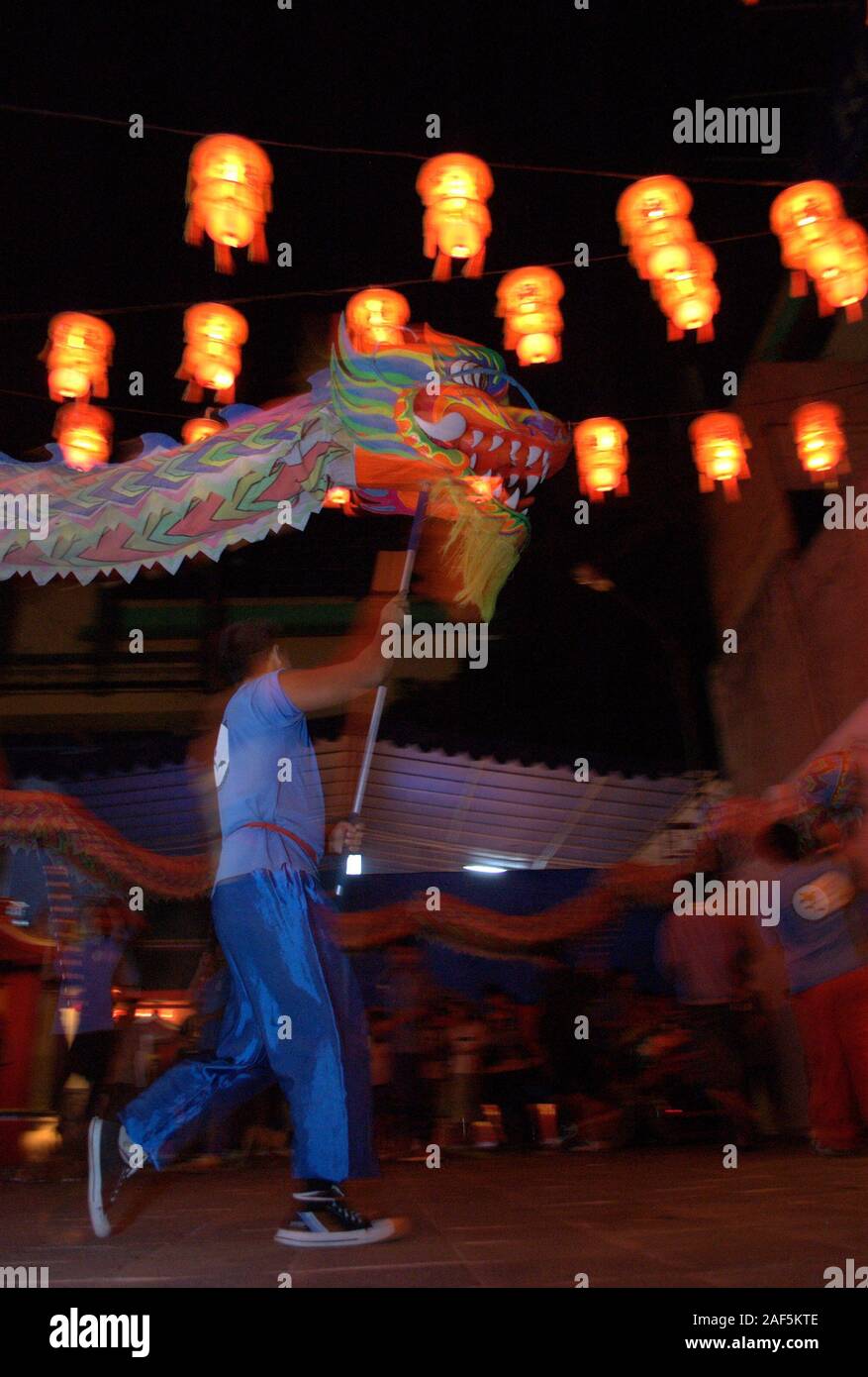 Dragon puppet dancers in Chinese New Year Eve. Stock Photo