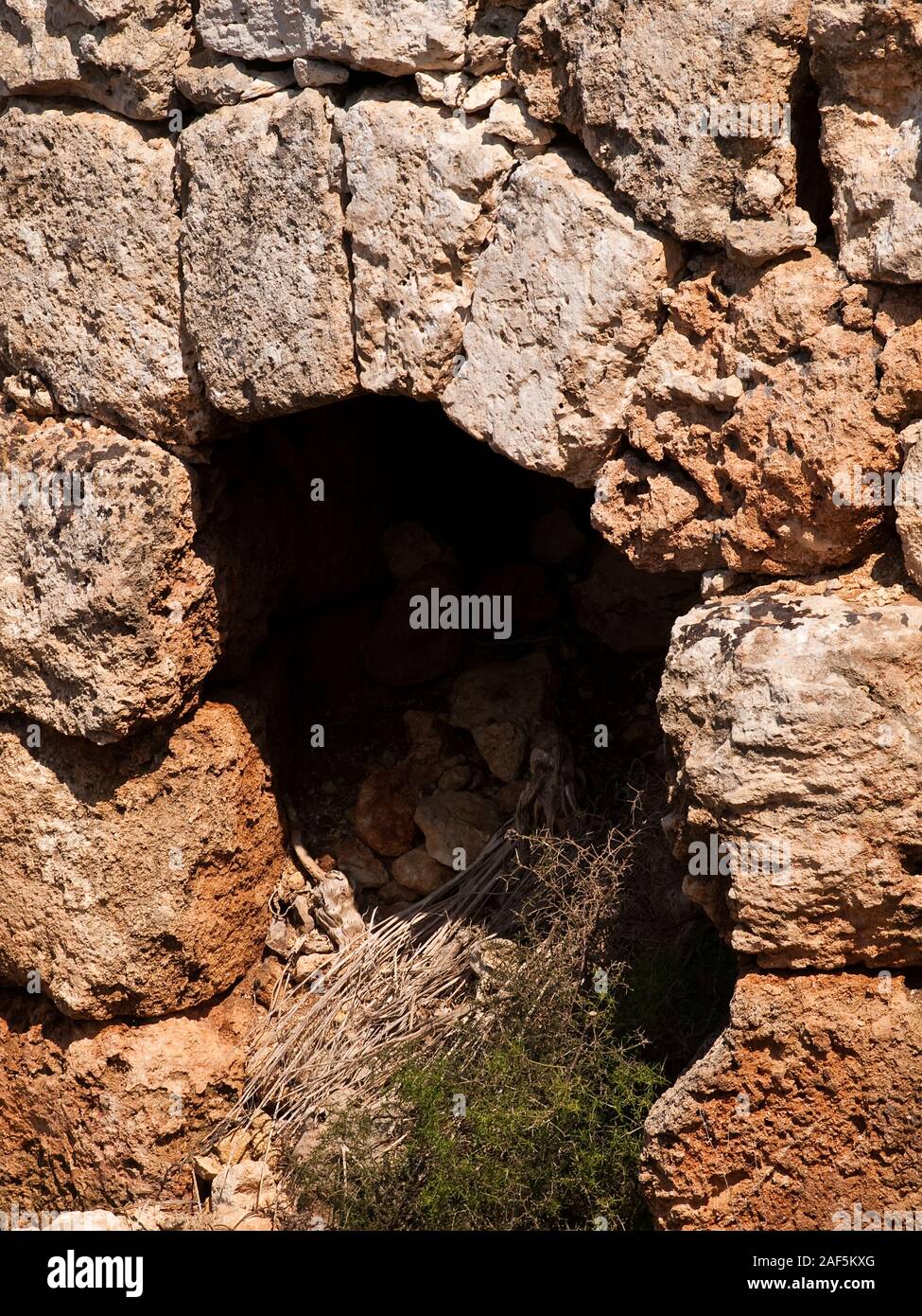 An old and neglected historic Roman wall on the island of Malta Stock Photo