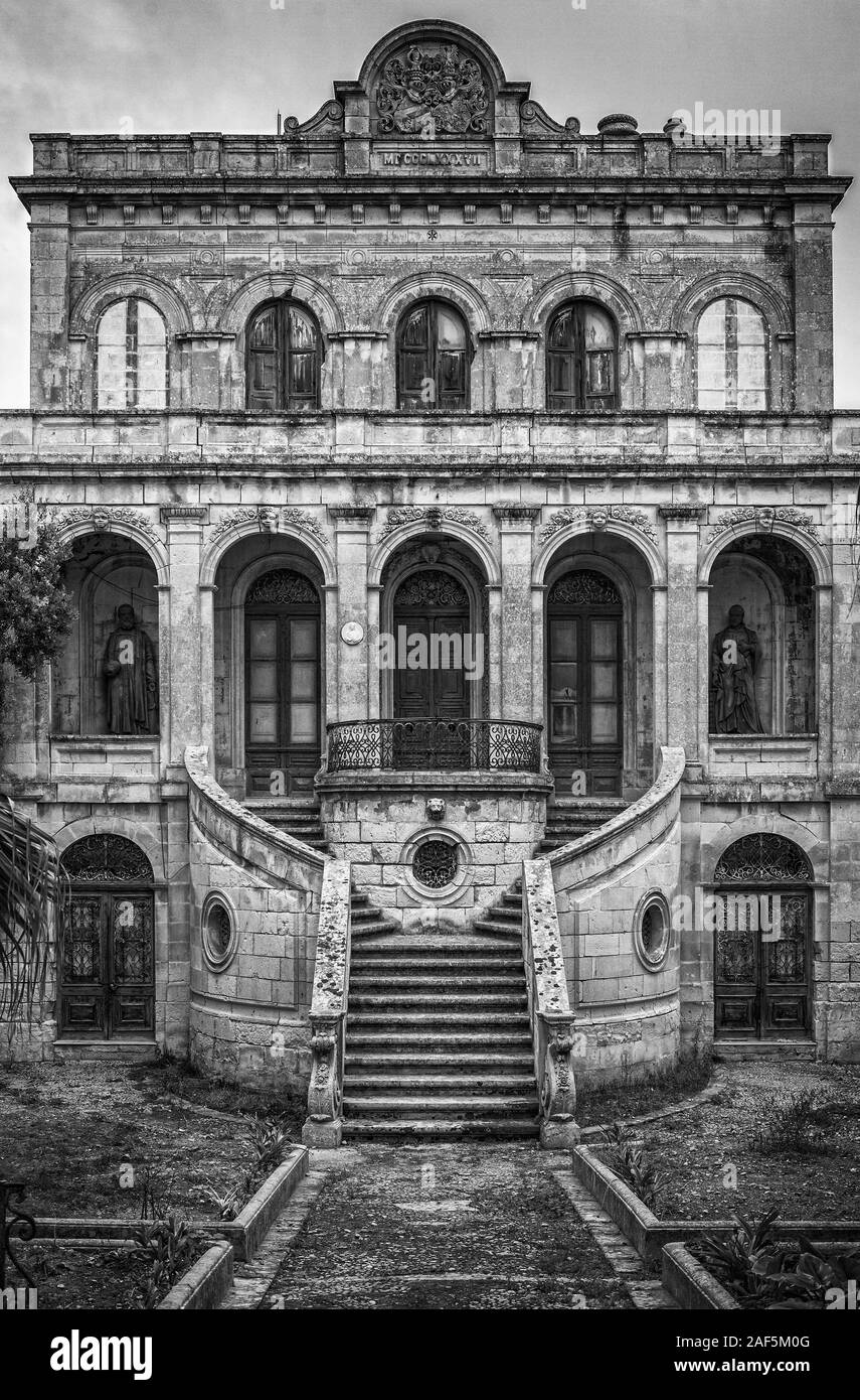 A seemingly haunted, abandoned and spooky house in Malta. Stock Photo