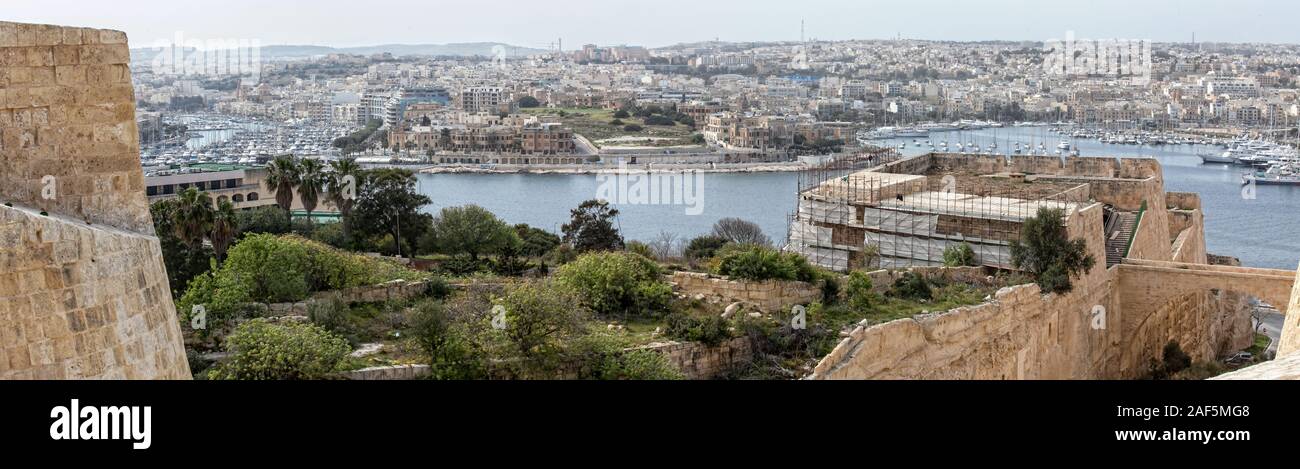 Ta' Xbiex point, as seen from Hastings Gardens in Valletta.  Restoration works on the Valletta bastions being carried out in the foreground Stock Photo