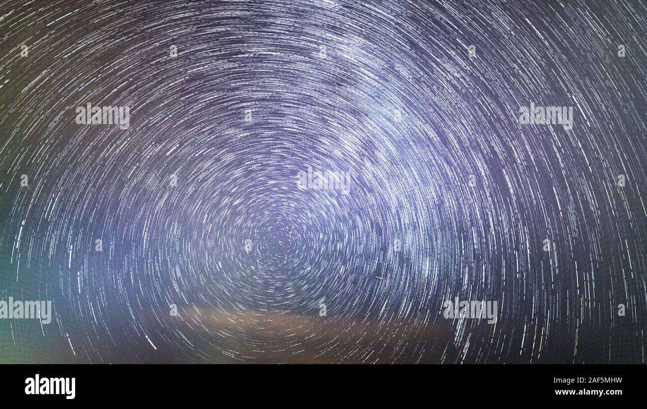 Star Trails around Polaris with cloud foreground Stock Photo - Alamy
