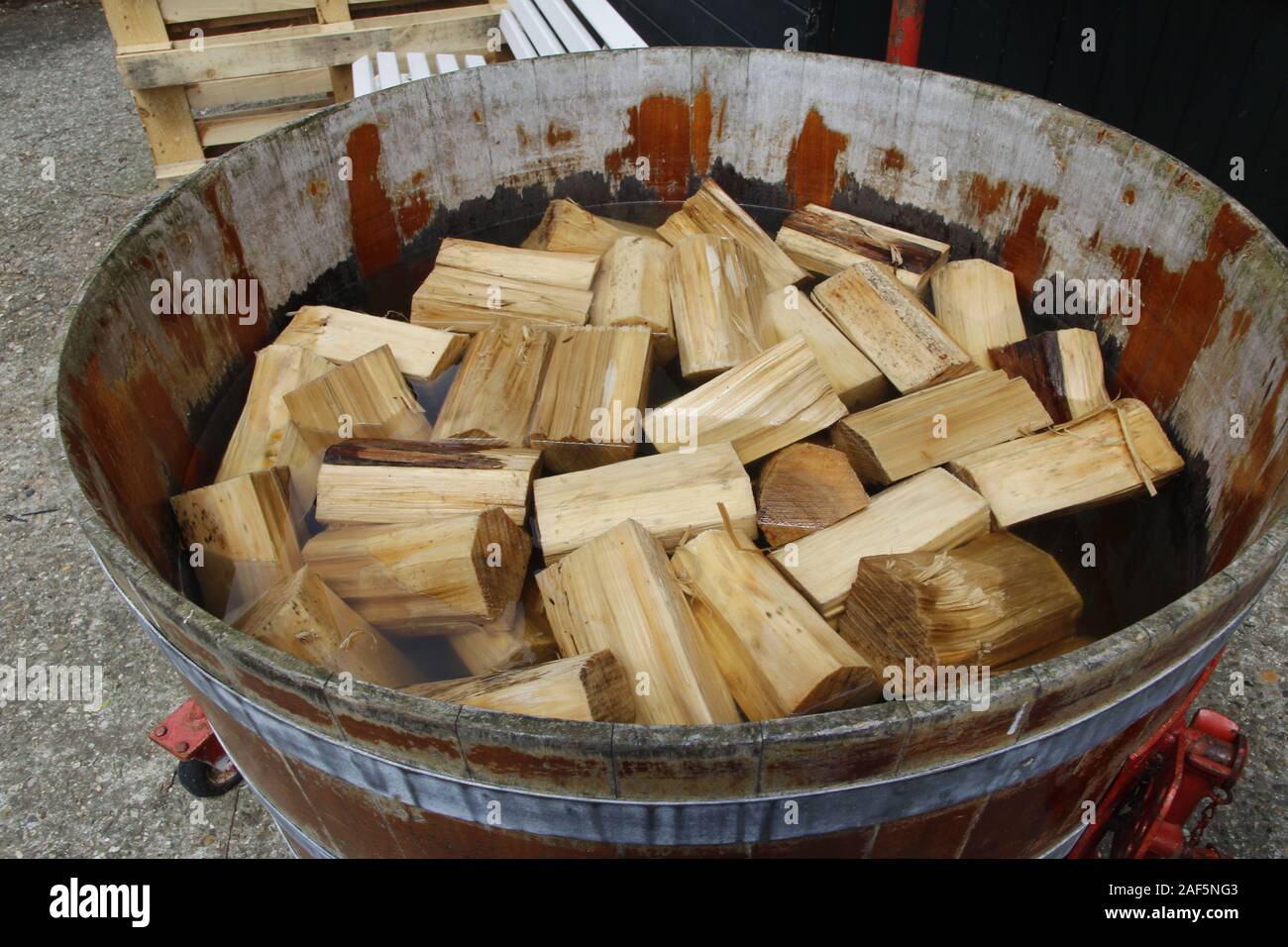 Poplar wood soak in the water before use it for Dutch Clogs Stock Photo