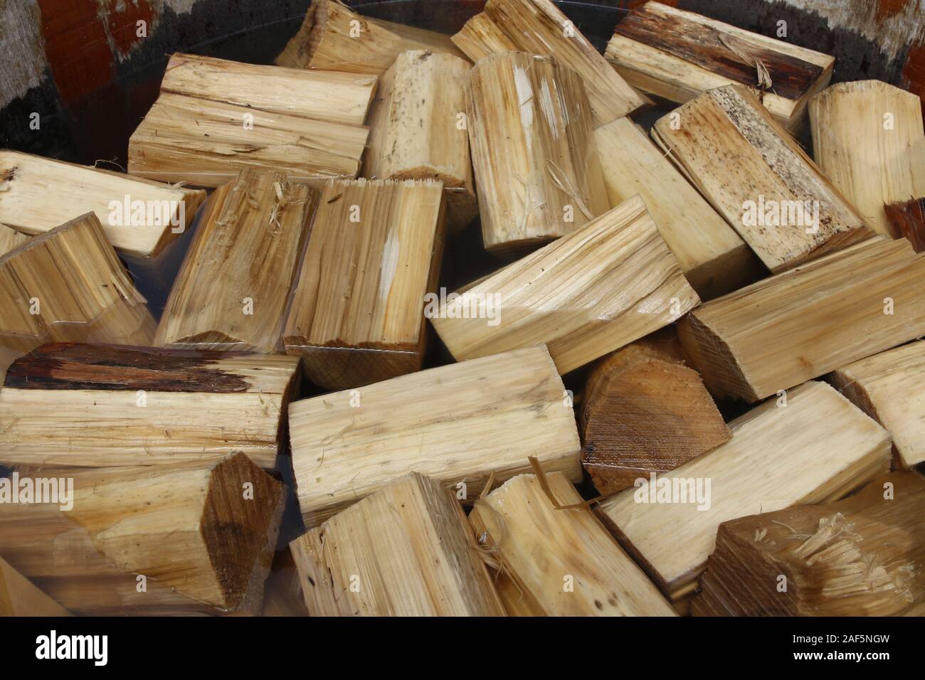 Poplar wood soak in the water before use it for Dutch Clogs Stock Photo
